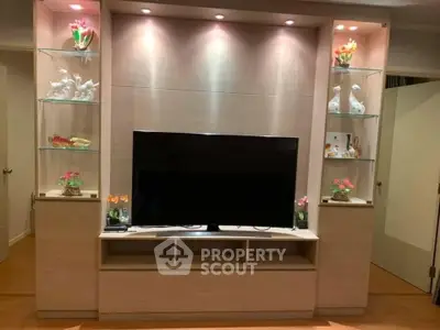 Modern living room with stylish TV unit and decorative shelves