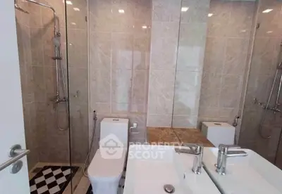 Modern bathroom with dual sinks and sleek shower design