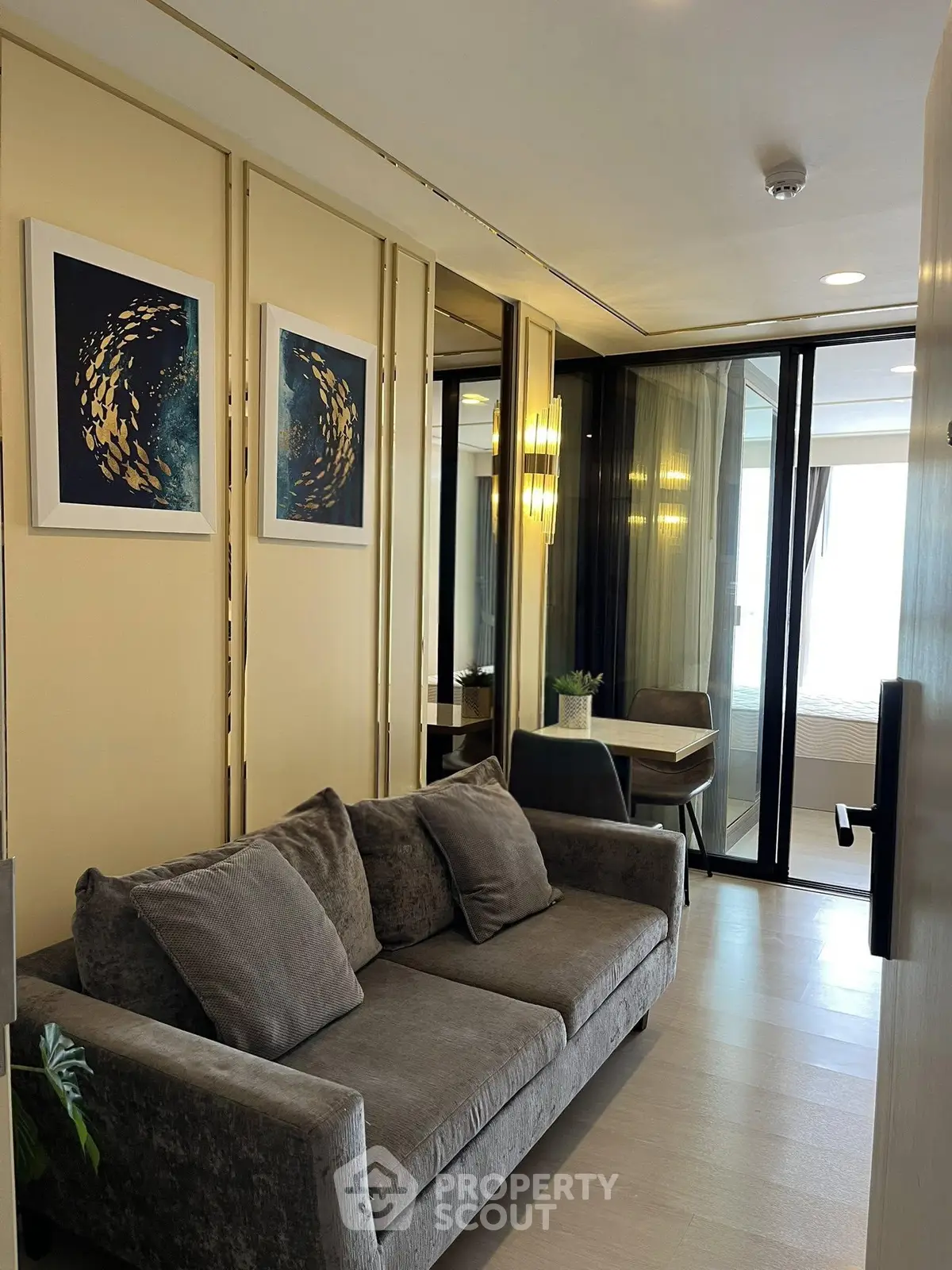 Modern living room with stylish decor and cozy seating in a contemporary apartment.