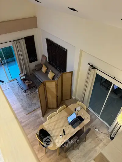 Stylish living room with modern decor and open layout, perfect for entertaining.