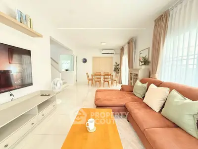 Spacious living room with modern decor and cozy seating area