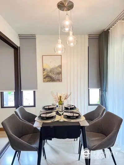 Modern dining area with elegant lighting and stylish decor