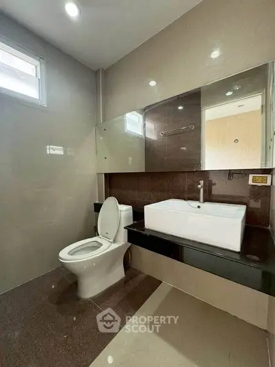 Modern bathroom with sleek design and large mirror