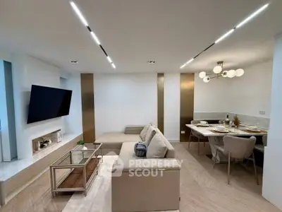 Modern living room with sleek design and elegant dining area