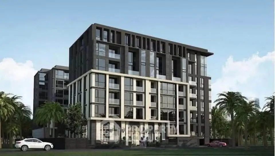 Modern apartment building with sleek design and palm trees in the foreground.