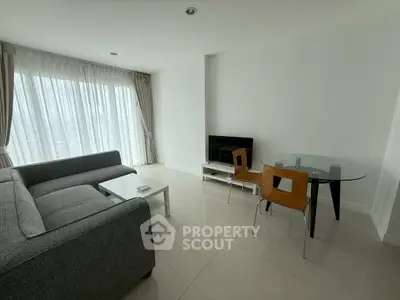 Modern minimalist living room with sleek furniture and large windows