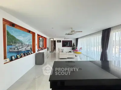 Spacious modern living room with large windows and elegant decor