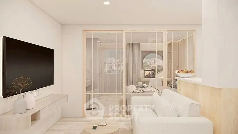 Modern living room with sliding glass doors and city view, featuring sleek furniture and neutral tones.