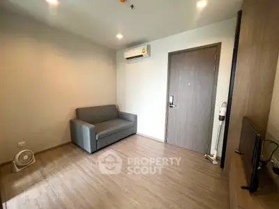 Modern living room with sleek sofa and air conditioning in a cozy apartment