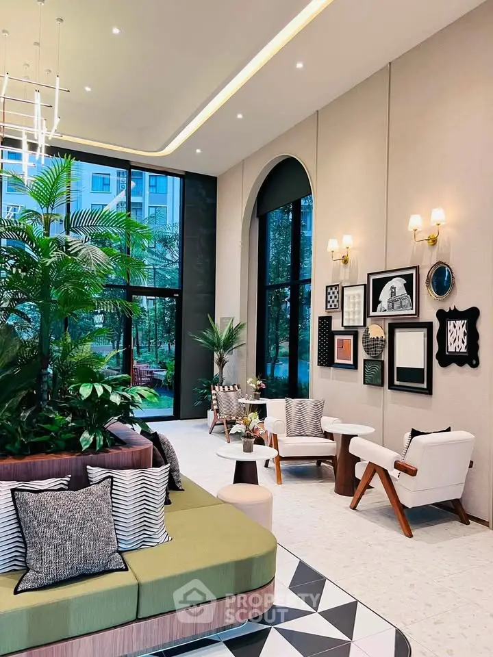 Luxurious modern lobby with stylish seating and lush greenery, perfect for relaxation and social gatherings.
