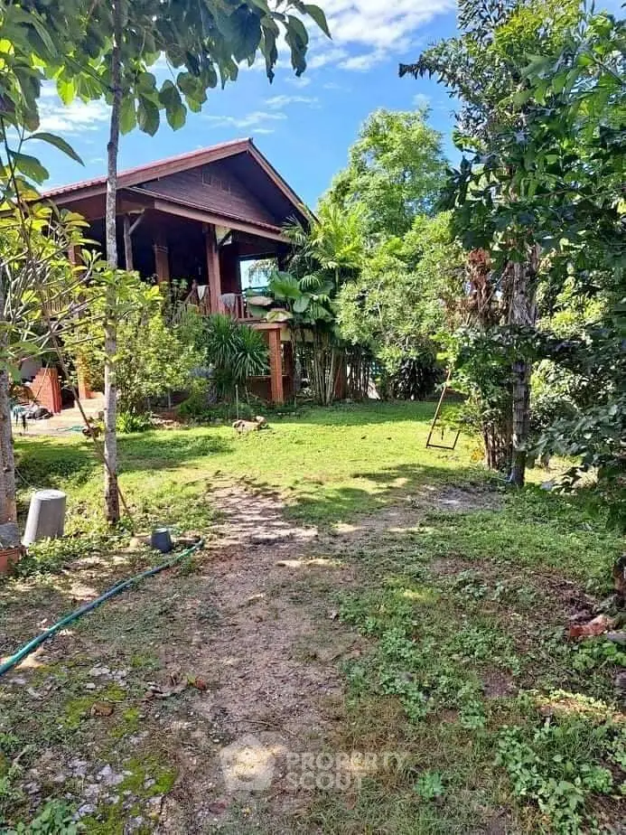 Charming rustic house with lush garden and serene outdoor space, perfect for nature lovers.