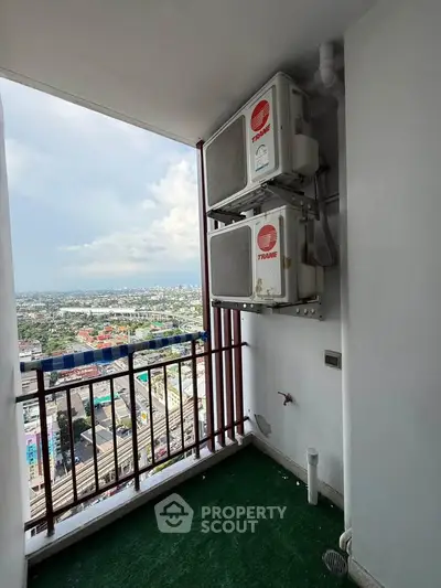 High-rise balcony with air conditioning units and panoramic city view
