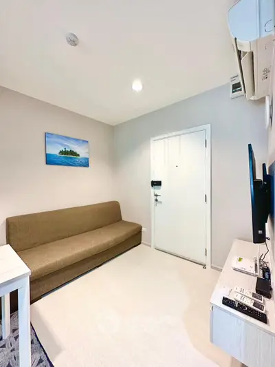 Cozy living room with modern decor and wall-mounted TV