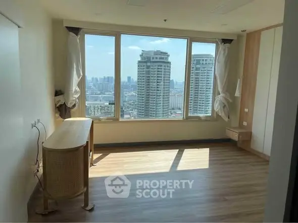 Spacious room with panoramic city view and large windows