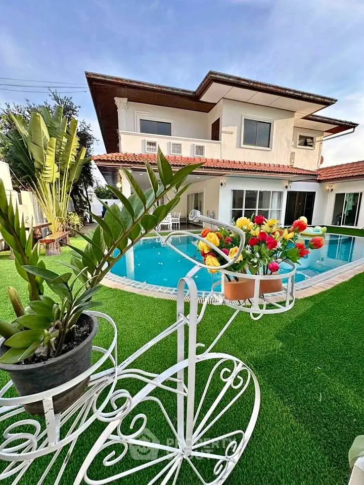 Luxurious villa with private pool and lush garden, perfect for relaxation and entertaining.