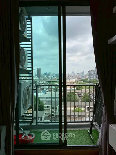 Stunning city view from a modern balcony with air conditioning units.