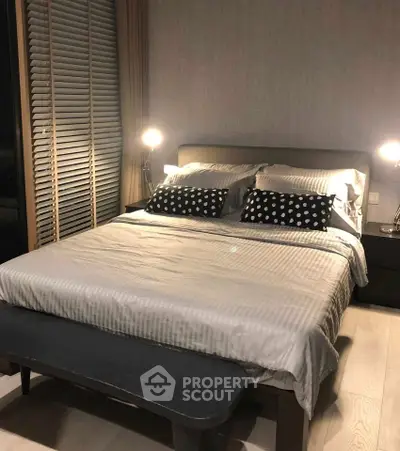 Elegant bedroom with cozy lighting and modern decor, perfect for relaxation and comfort.