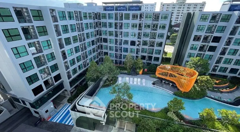 Modern condominium with pool and landscaped garden in urban setting