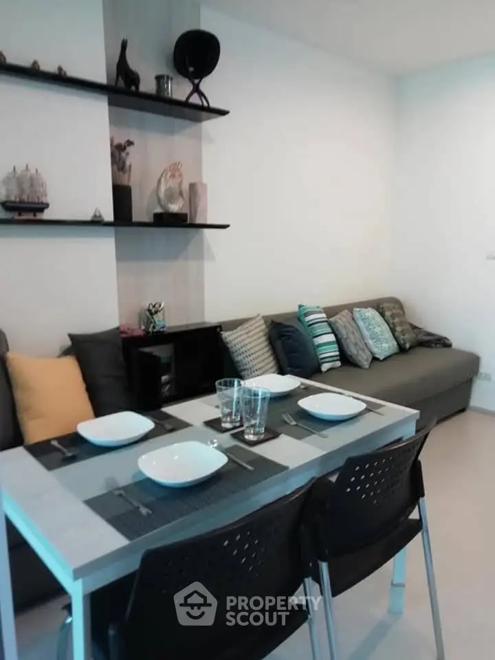 Modern living room with stylish decor and dining area, perfect for cozy gatherings.