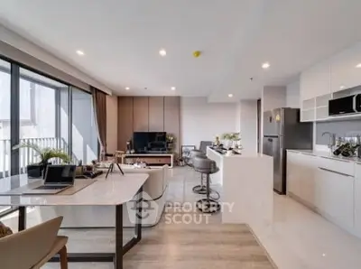 Spacious modern living room with open kitchen and stylish decor