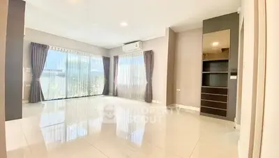 Spacious living room with large windows and modern design