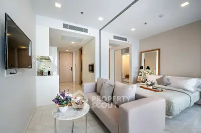 Modern open-plan living room with cozy sofa and elegant decor