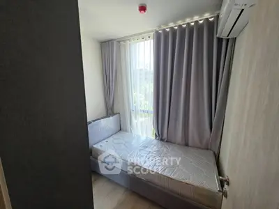 Cozy bedroom with natural light and modern air conditioning unit