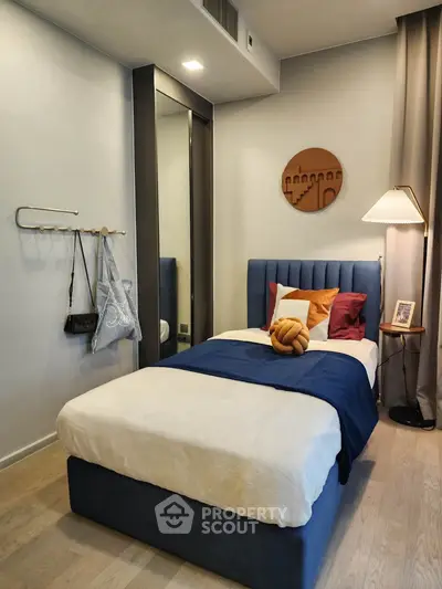 Cozy bedroom with modern decor and stylish furnishings, perfect for relaxation and comfort.