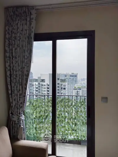 Modern apartment balcony with city view and elegant curtains