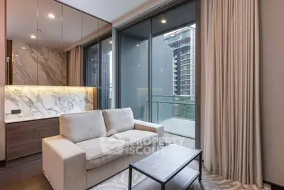 Modern living room with elegant marble accents and balcony view in luxury apartment.