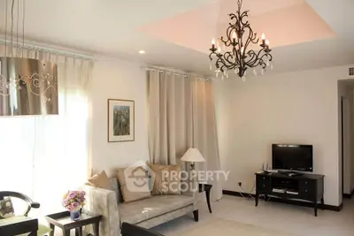 Elegant living room with chandelier and modern decor