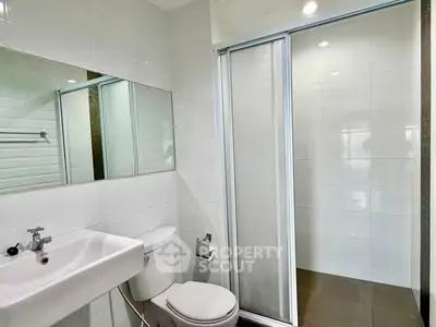 Modern bathroom with sleek design and glass shower enclosure