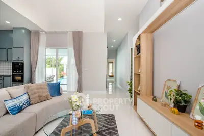 Modern living room with stylish decor and pool view