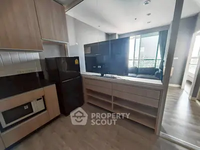 Modern open-layout kitchen with sleek appliances and spacious living area