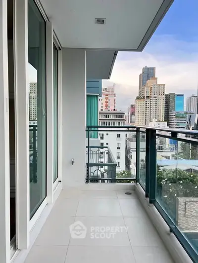 Spacious balcony with city skyline view in modern high-rise apartment