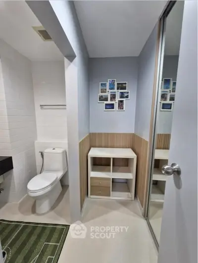 Modern bathroom with sleek design and wall art accents