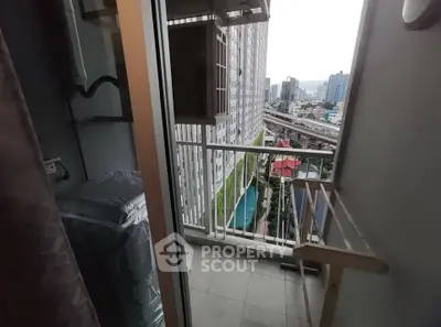 Charming balcony with city view, perfect for relaxation and enjoying urban scenery.