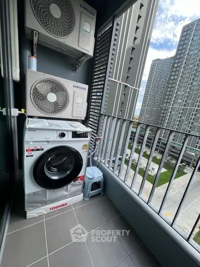 Modern balcony with washing machine and city view in high-rise apartment