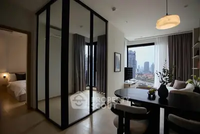 Modern apartment interior with city view, featuring dining area and bedroom access.
