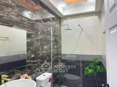 Luxurious modern bathroom with elegant marble tiles and stylish fixtures