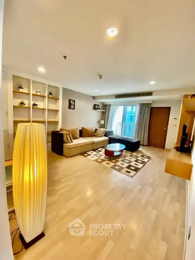 Spacious modern living room with cozy seating and elegant decor