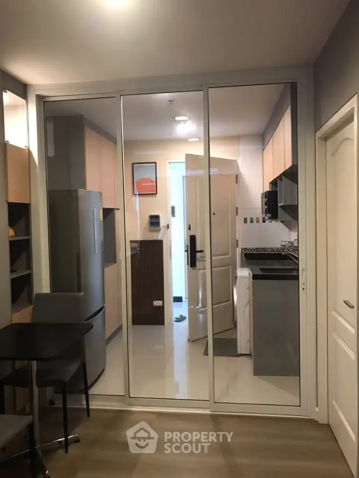 Modern kitchen with sleek appliances and glass sliding doors