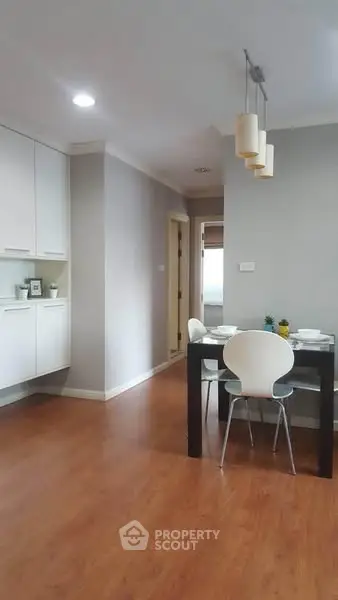 Modern dining area with sleek design and wooden flooring