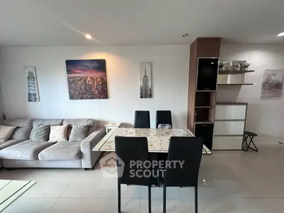 Modern living room with stylish dining area and cozy sofa, perfect for urban living.