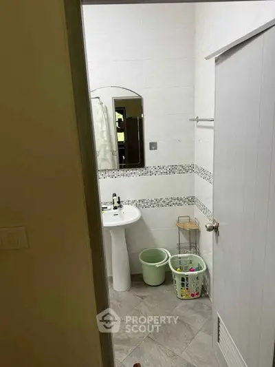 Cozy bathroom with modern fixtures and stylish tile accents.