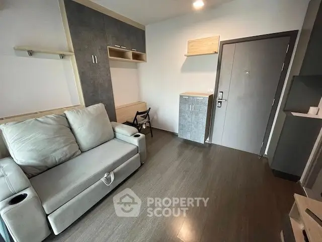 Modern living room with sleek design and cozy sofa in a stylish apartment.
