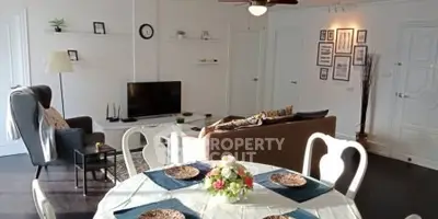 Spacious living room with elegant dining area and modern decor
