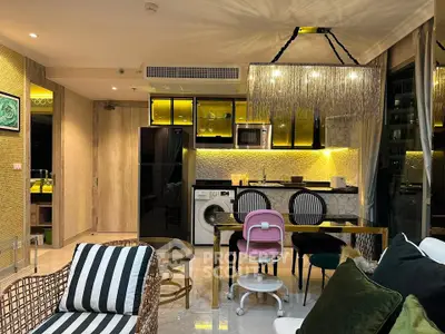 Luxurious modern living room with open kitchen, stylish decor, and elegant lighting in a high-end apartment.