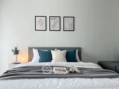 Modern bedroom with stylish decor and cozy bedding