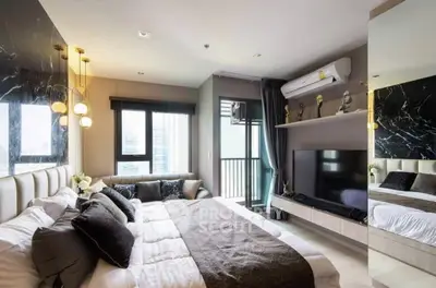 Luxurious modern bedroom with balcony and stylish decor